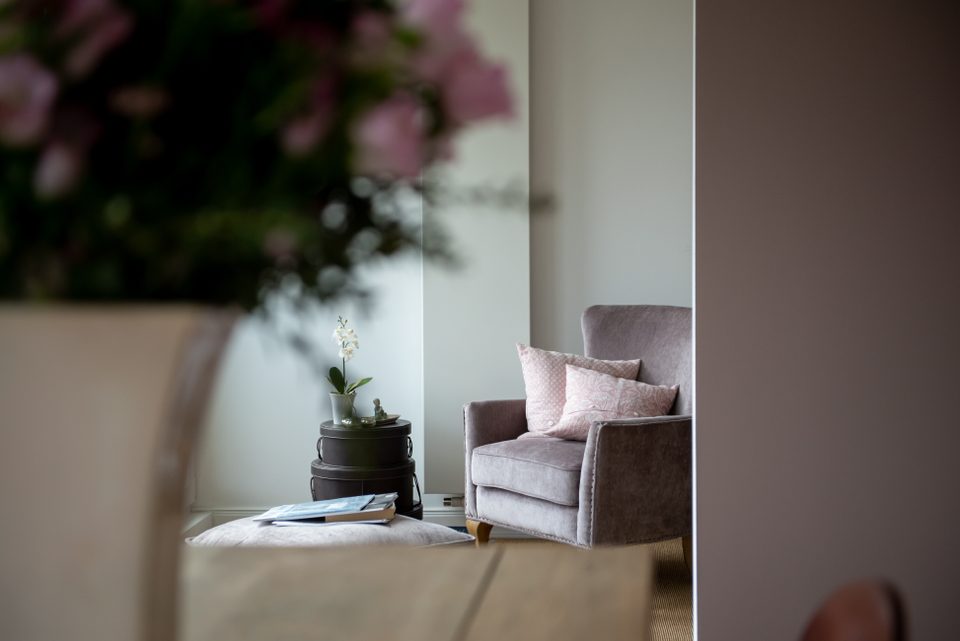 Living area with an armchair and flowers