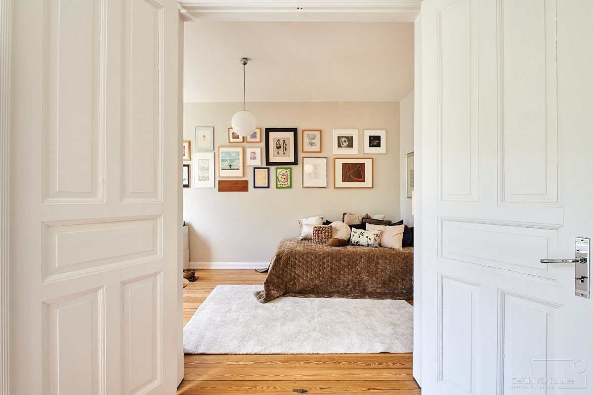 Living room beyond white double doors